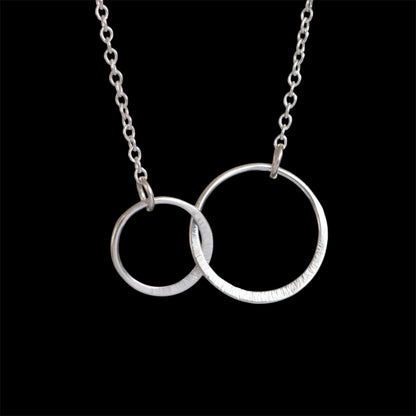 Sterling silver infinity necklace.