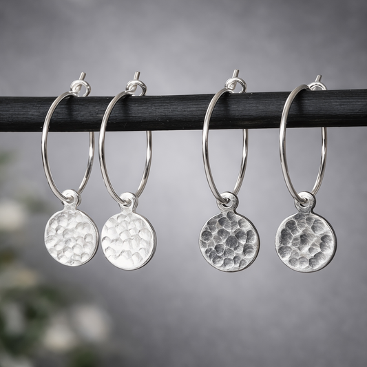 Hammered sterling silver disc charm hoop earrings.