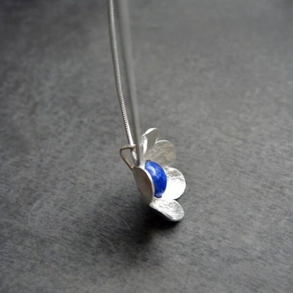Artisan lapis lazuli flower sterling silver pendant necklace.