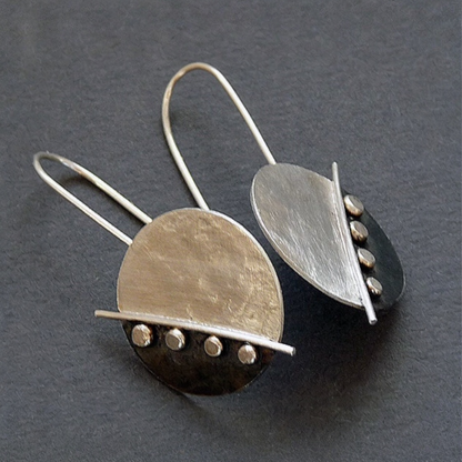 Large sterling silver disc earrings.