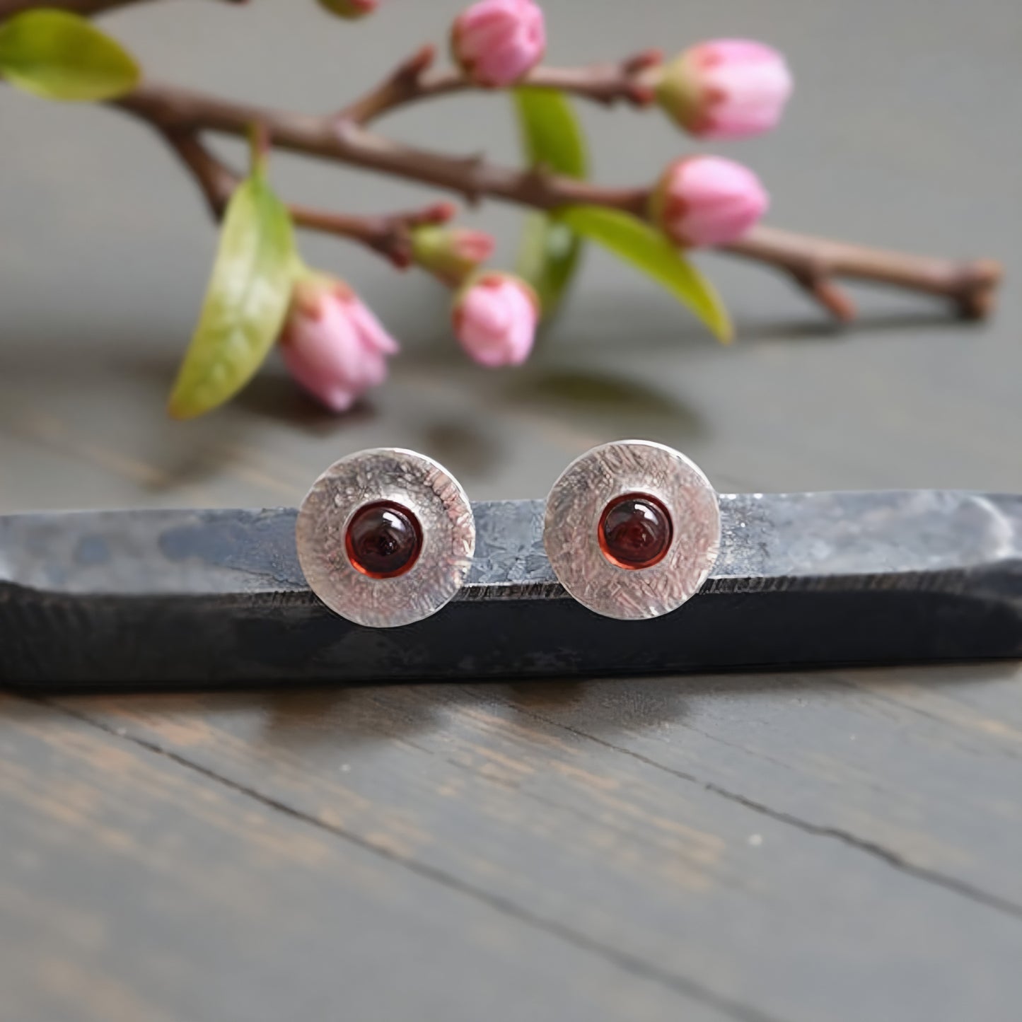 Garnet sterling silver disc stud earrings.