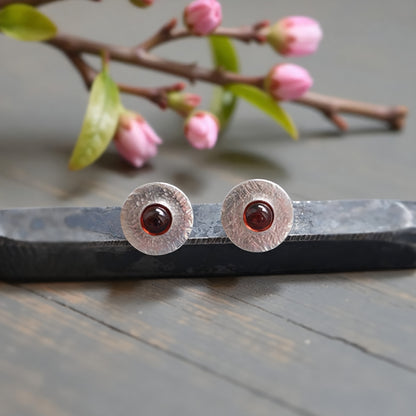 Garnet sterling silver disc stud earrings.