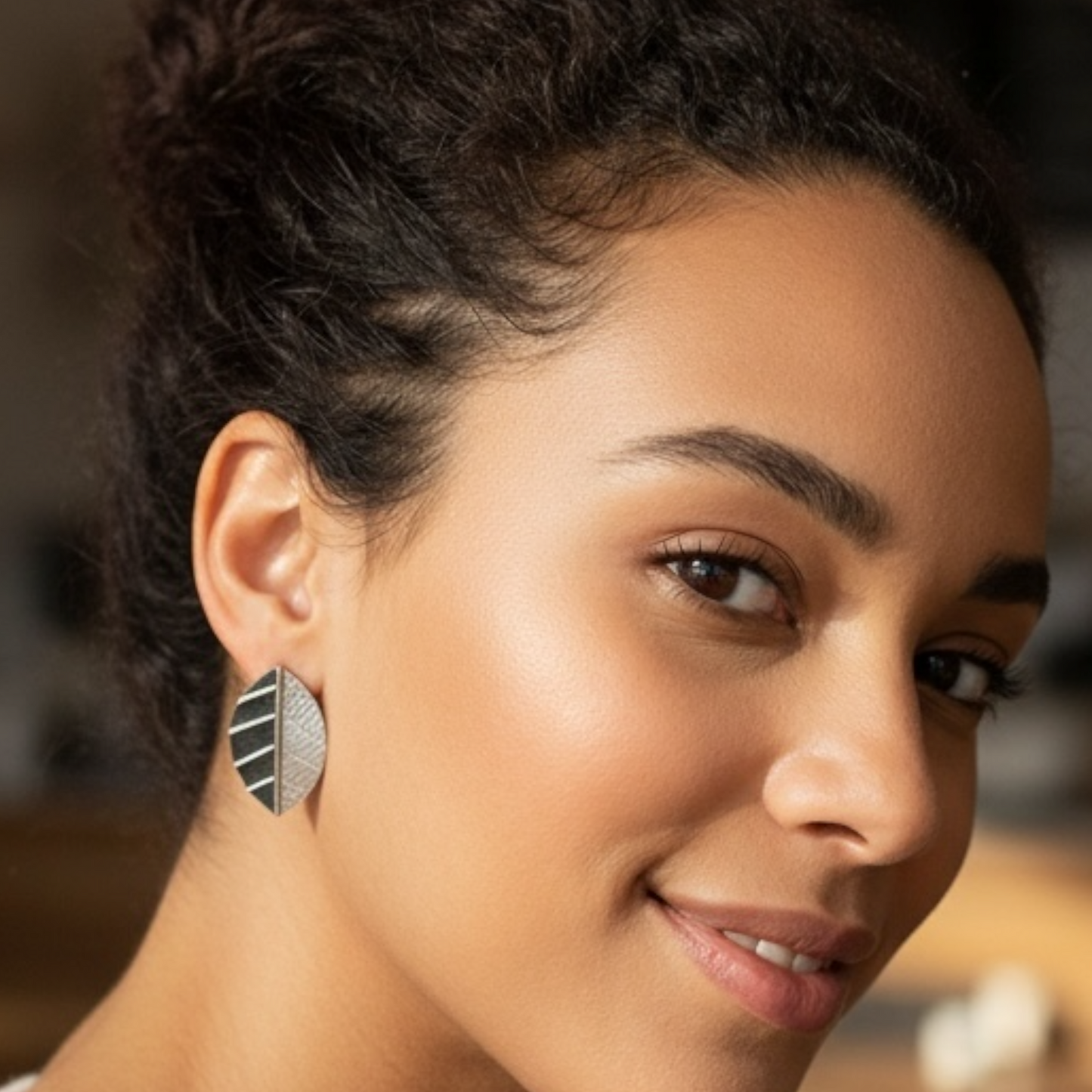 Sterling silver leaf stud earrings.