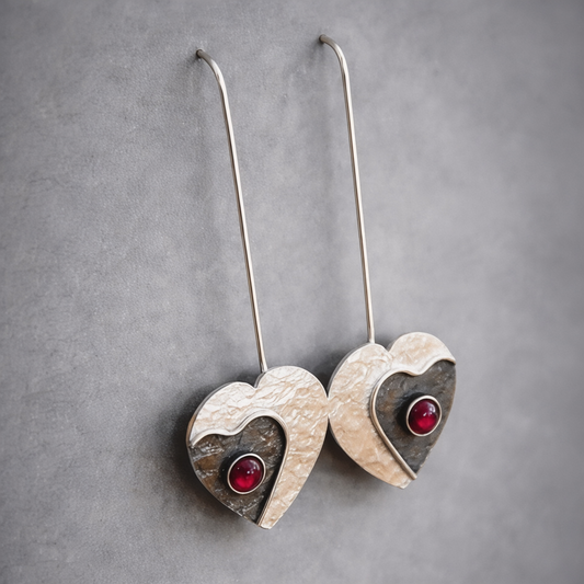 Garnet sterling silver heart earrings.