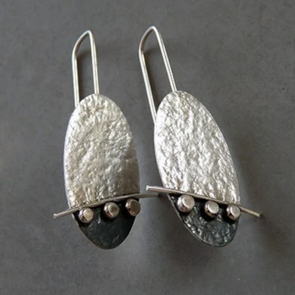 Artisan oval sterling silver drop earrings.