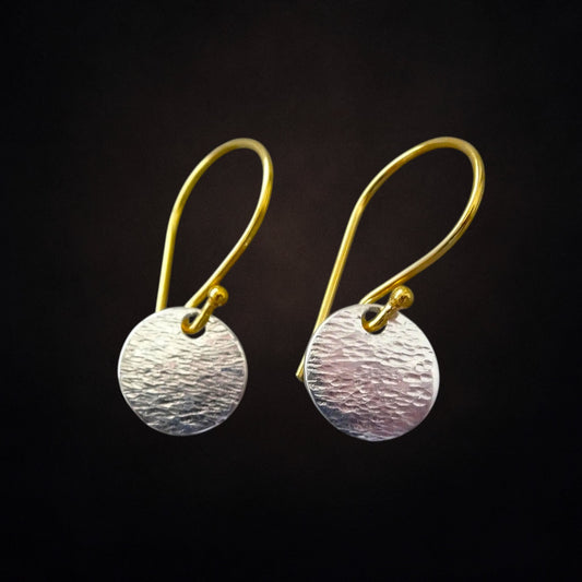 Hammered sterling silver disc and gold vermeil ear wire earrings.
