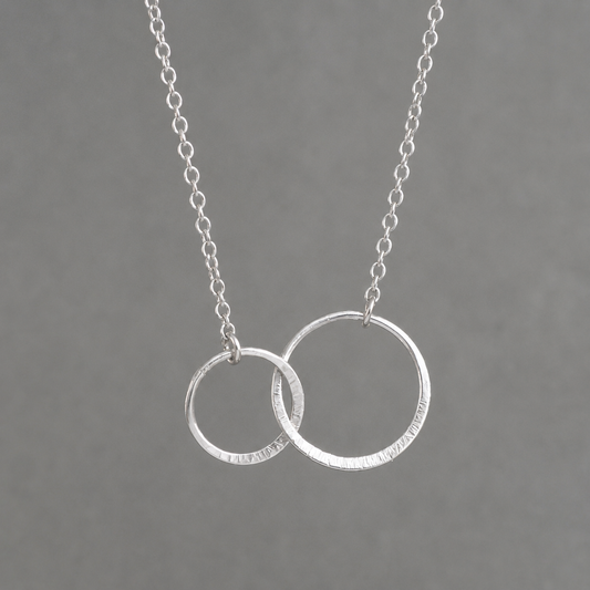 Sterling silver infinity necklace.