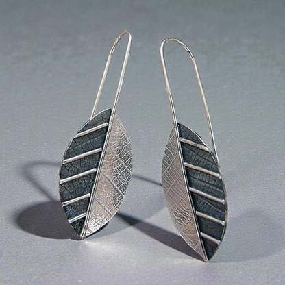 Sterling silver leaf earrings.