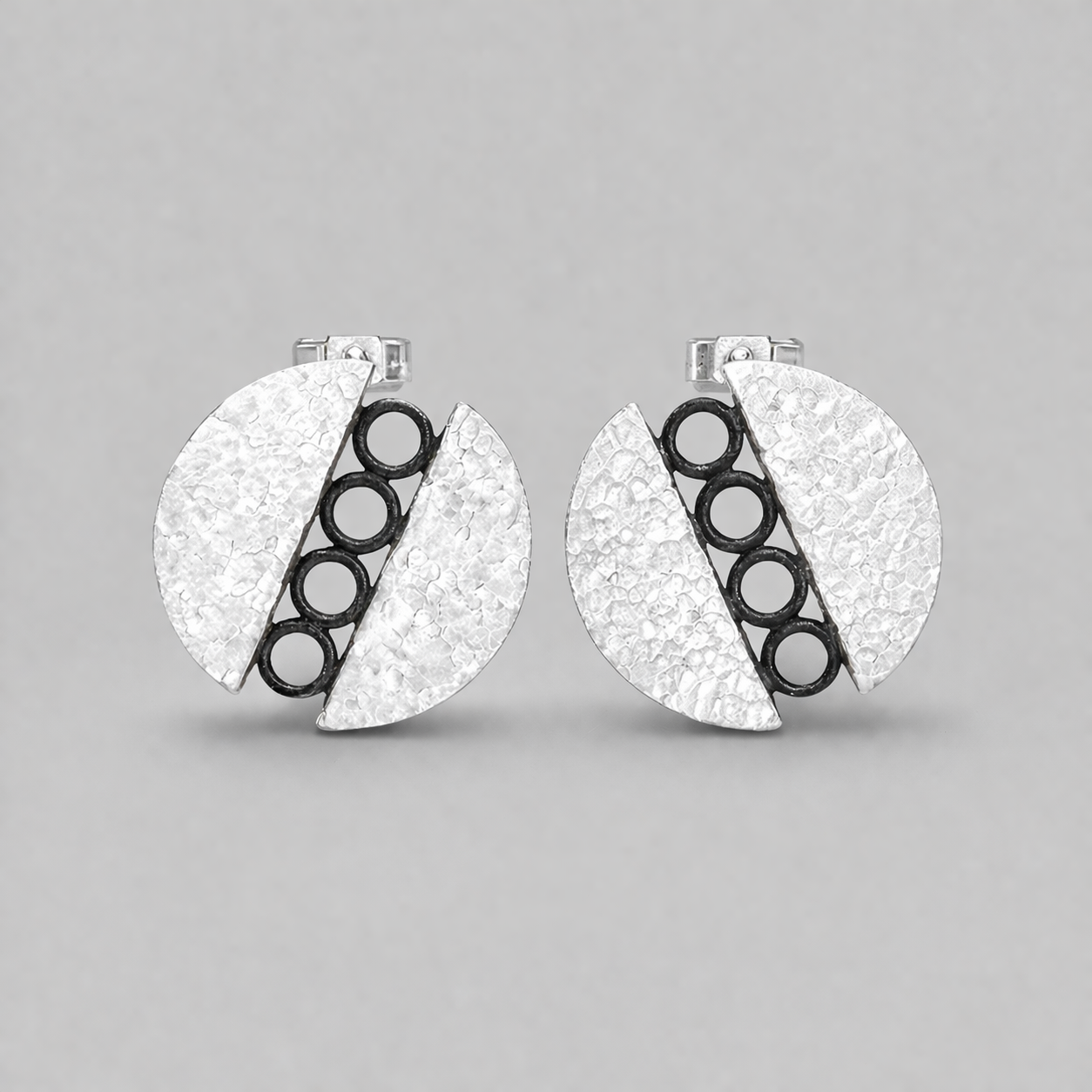 Sterling silver circle stud earrings.