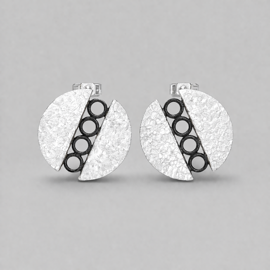 Sterling silver circle stud earrings.