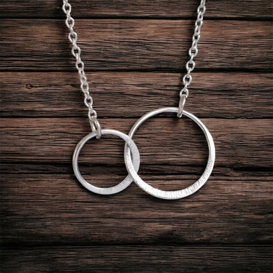 Sterling silver infinity necklace.