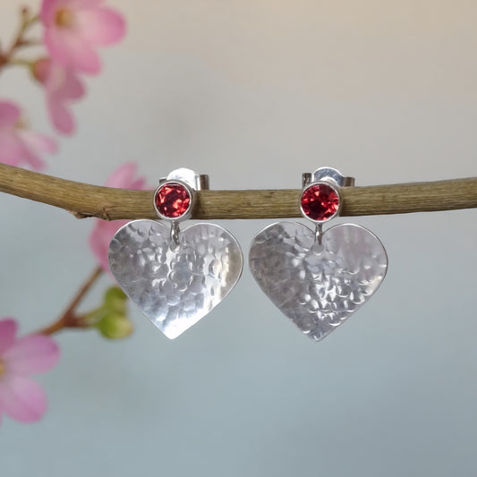 Garnet January birthstone sterling silver heart stud earrings.