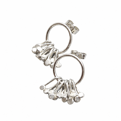 Sterling silver circle and droplets stud earrings.