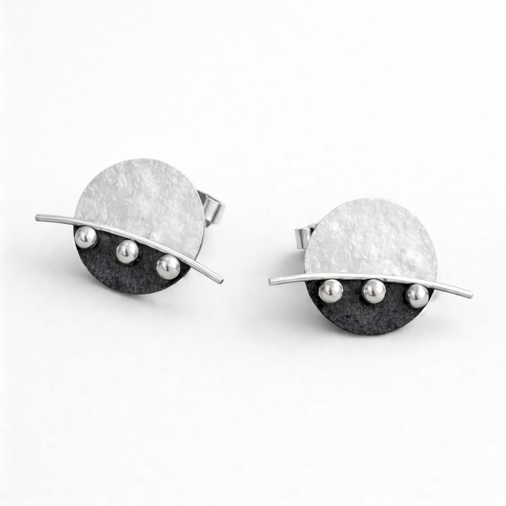 Sterling silver disc stud earrings.