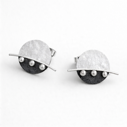 Sterling silver disc stud earrings.