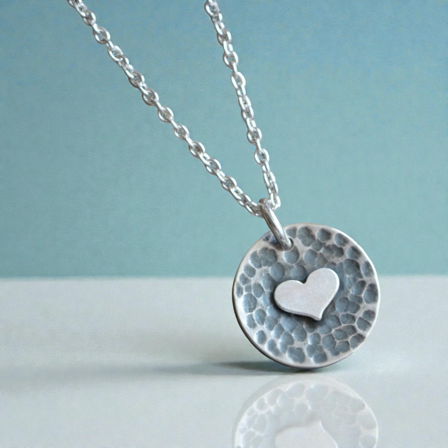 Sterling silver heart disc pendant