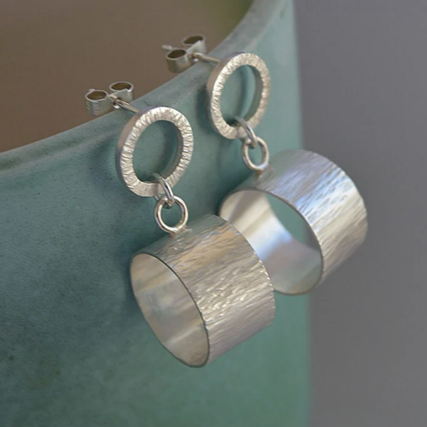 Sterling silver hammered circle stud earrings.