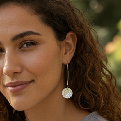 Hammerd sterling silver disc dangle earrings.