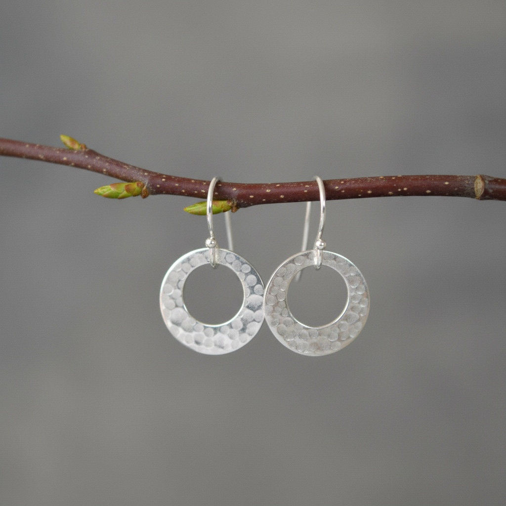 Hammered circle sterling silver earrings.