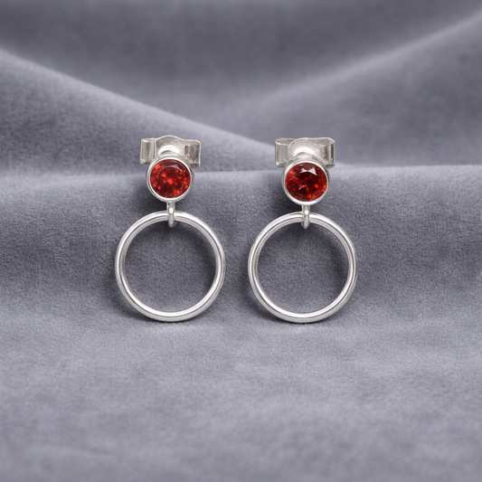 Garnet sterling silver circle earrings.