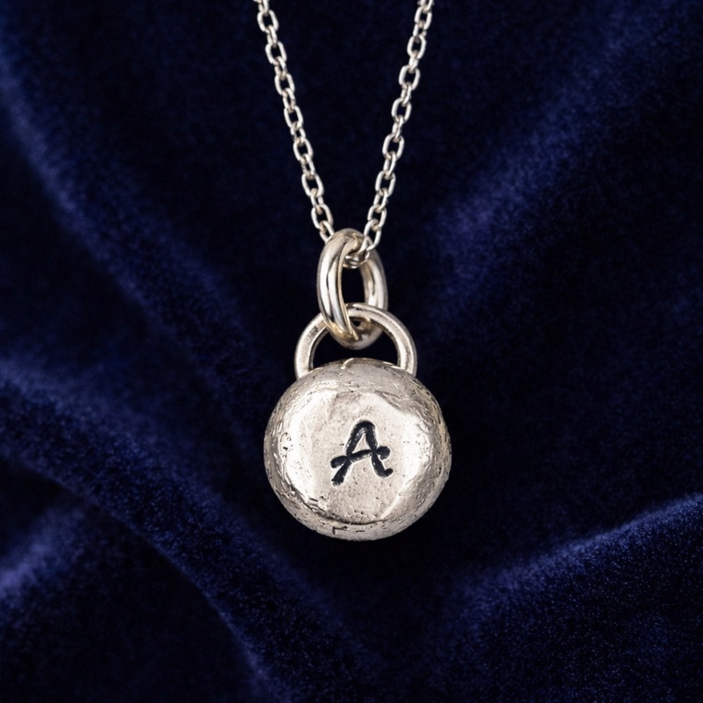 Pebble solid sterling silver personalised letter necklace.