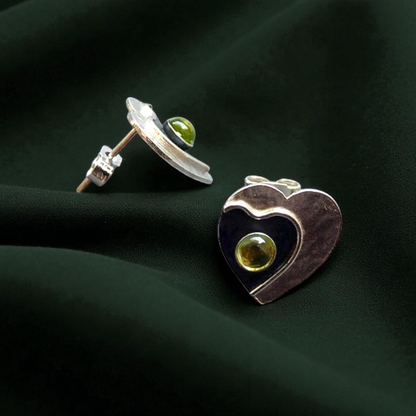 Peridot sterling silver heart stud earrings.