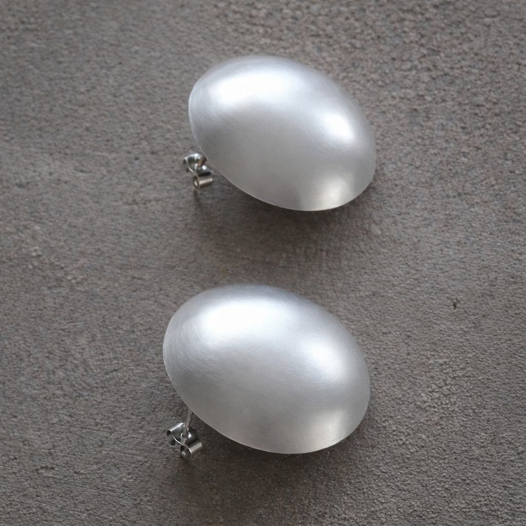 Large statement sterling silver bowl stud earrings.
