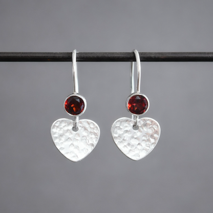 Garnet sterling silver heart dangle earrings.