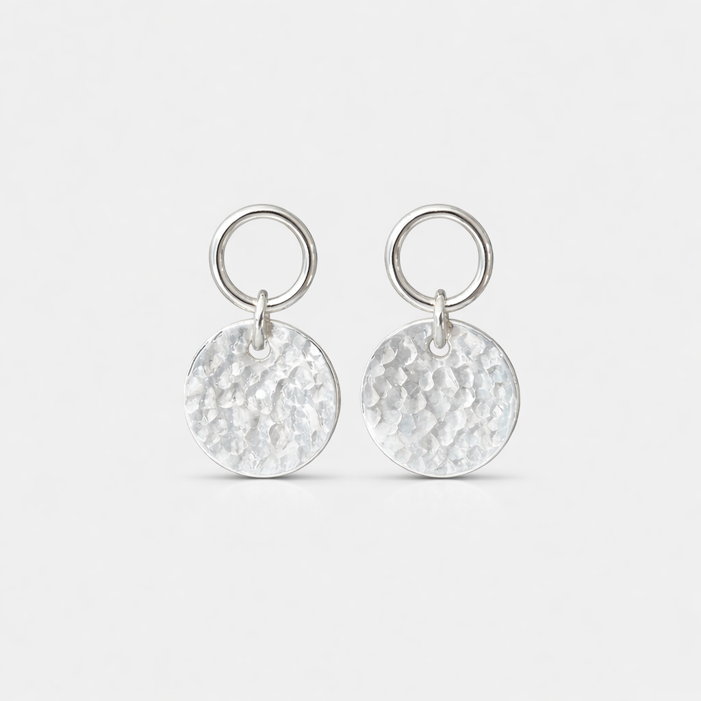 Sterling silver circle and hammered disc stud earrings.