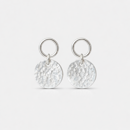 Sterling silver circle and hammered disc stud earrings.