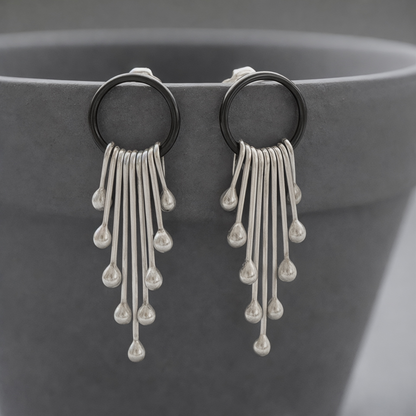 Sterling silver dangle earrings.