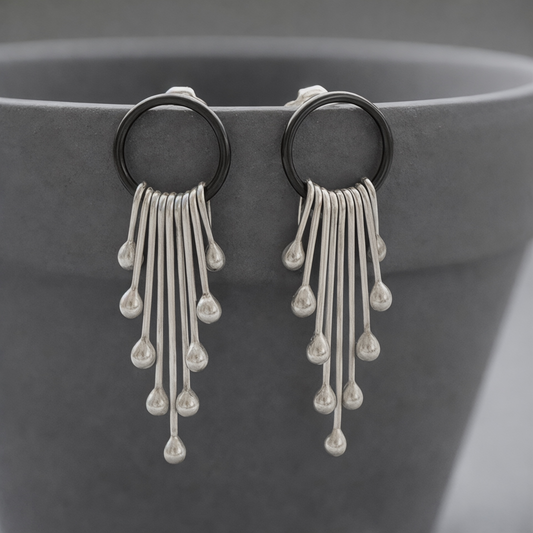 Sterling silver dangle earrings.
