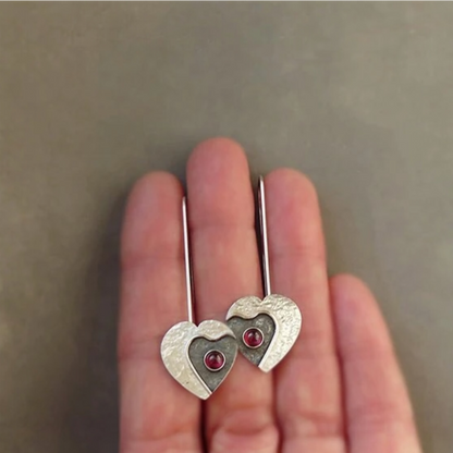 Garnet sterling silver heart earrings.
