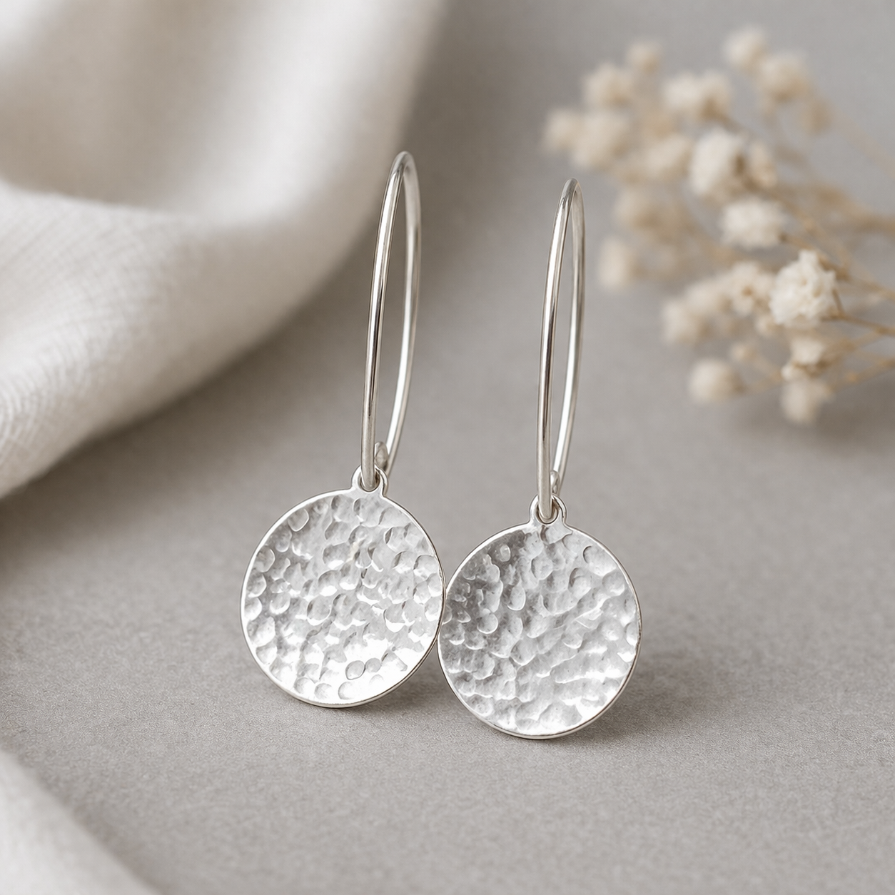 Sterling silver hammered disc earrings