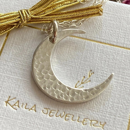 Crescent moon sterling silver necklace.