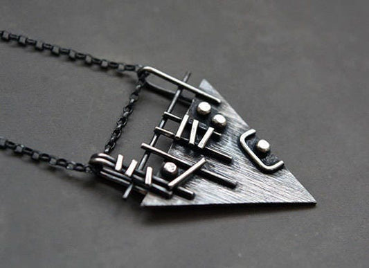 Sterling silver triangle necklace.