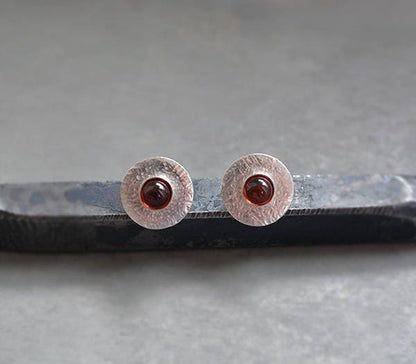 Garnet sterling silver disc stud earrings.