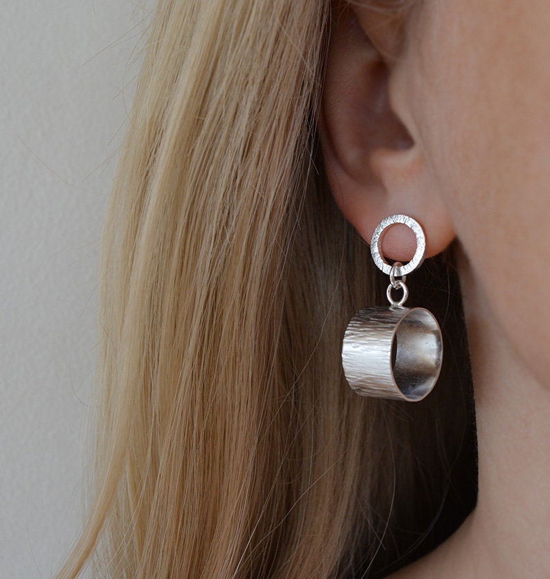 Sterling silver circle stud earrings.
