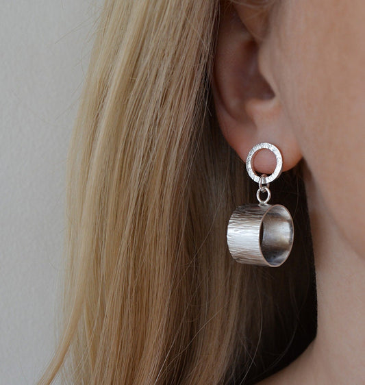 Sterling silver circle stud earrings.