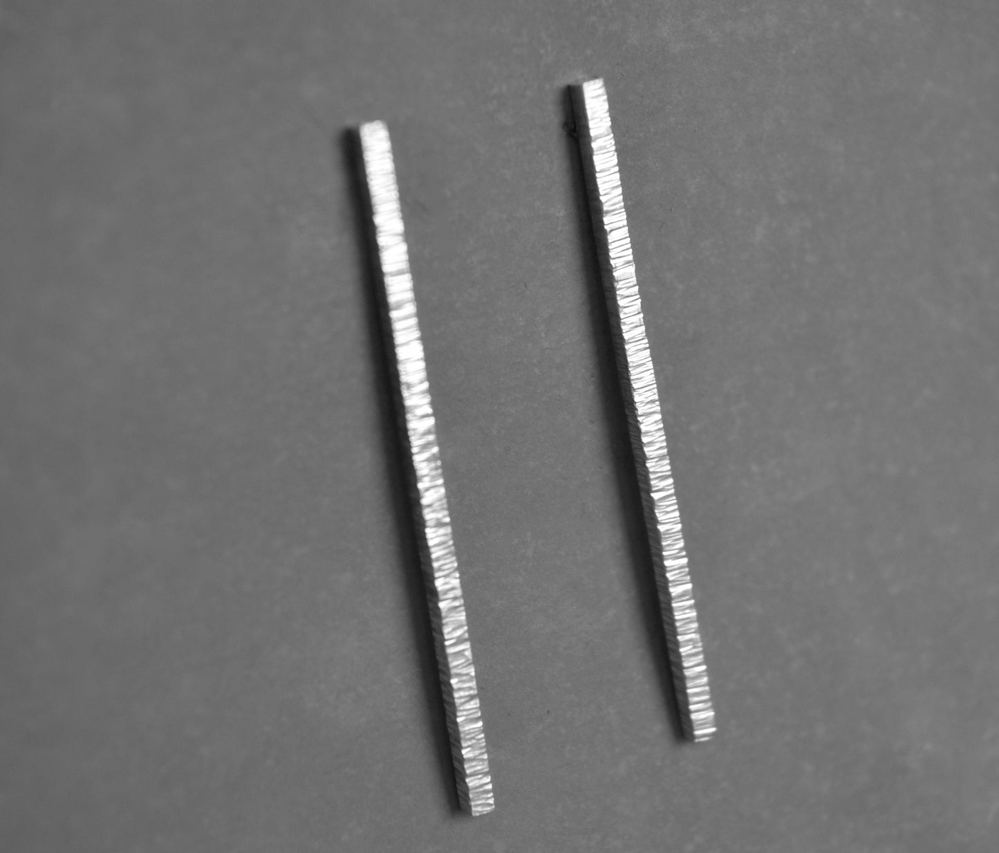 Hammered sterling silver bar stud earrings.