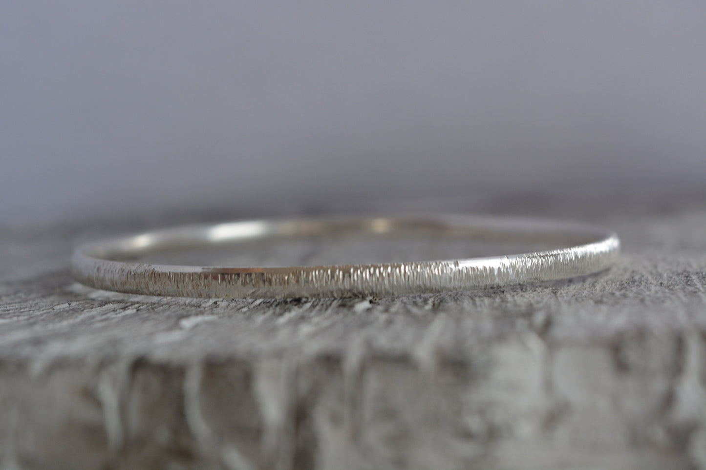 Hammered solid sterling silver bangle.