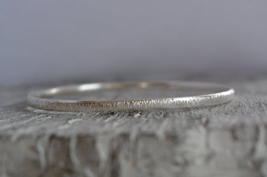 Hammered solid sterling silver bangle.