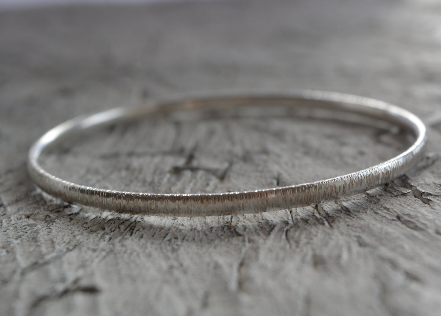 Hammered solid sterling silver bangle.