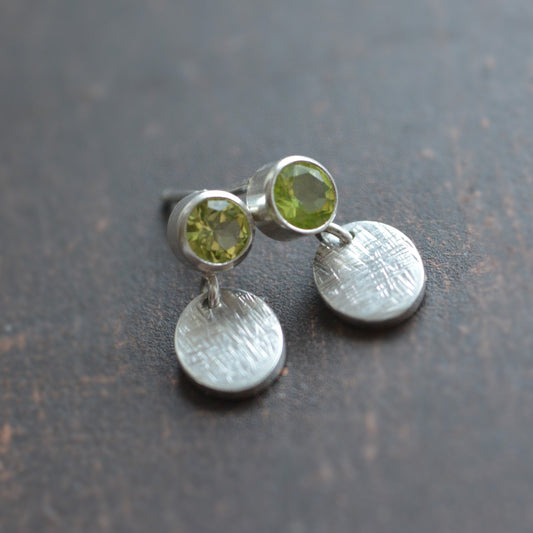 sterling silver peridot stud earrings with dangle ovals.