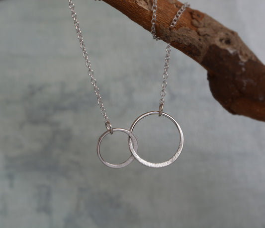Sterling silver infinity necklace.