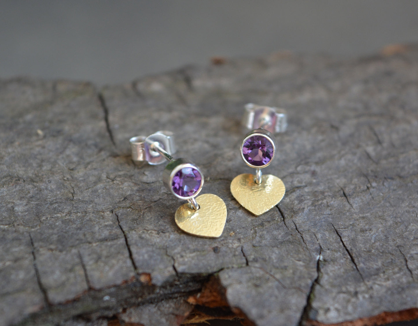 Amethyst sterling silver heart stud earrings.