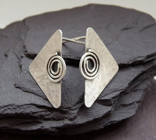 Sterling silver triangular stud earrings.