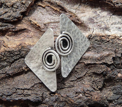 Sterling silver triangular stud earrings.