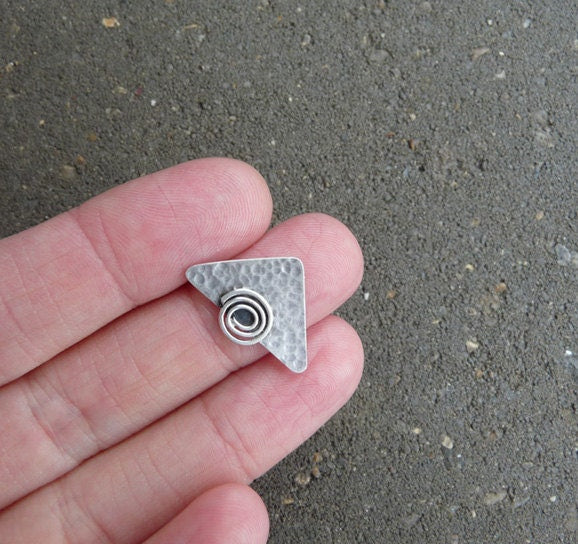 Sterling silver triangular stud earrings.