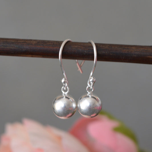 Ball sterling silver dangle earrings.